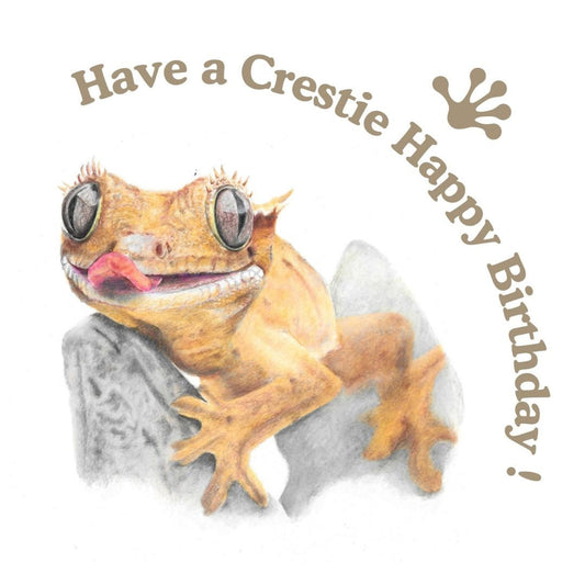 Crested Gecko on a rock with 'Have a Crestie Happy Birthday!' text