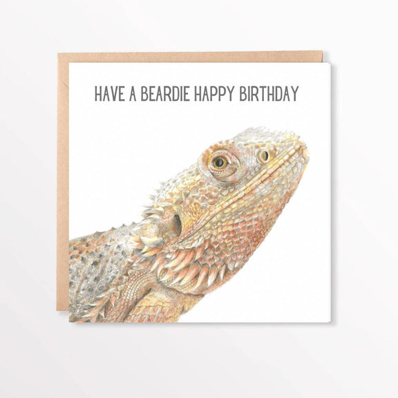 Birthday card with a bearded dragon illustration and text 'Have a beardie happy birthday' on a white background.
