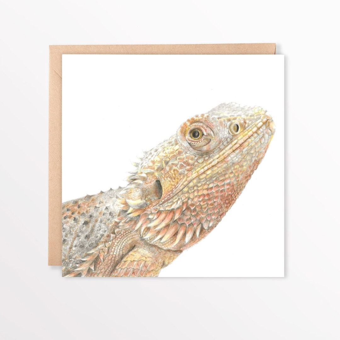 Bearded dragon illustration on a white card sat on a brown envelope