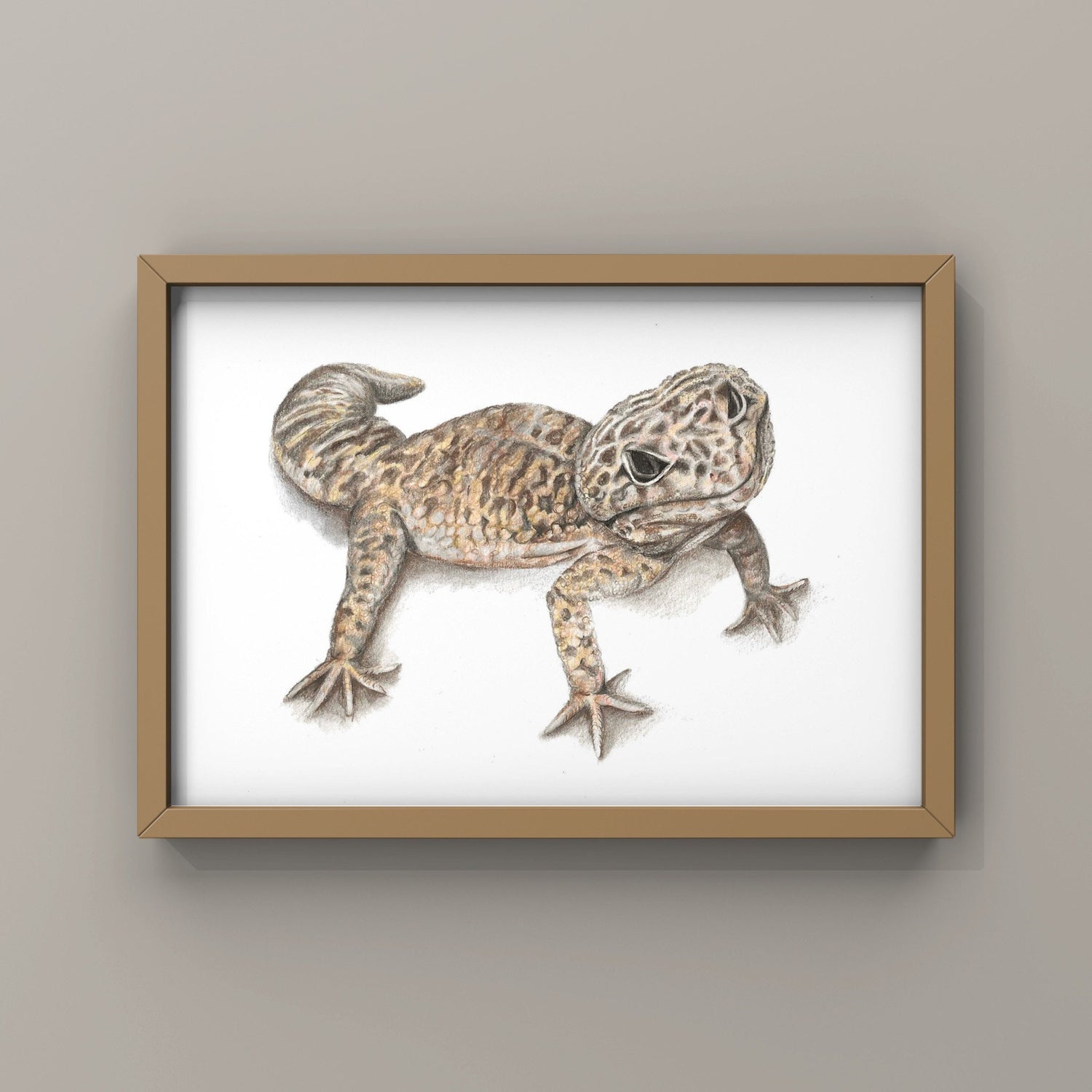 Framed artwork of a Leopard Gecko lizard on a beige wall