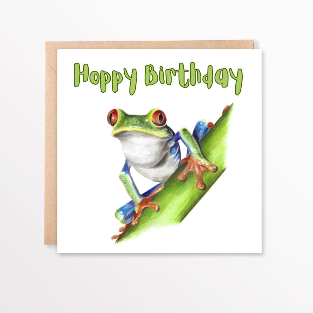 Birthday card with a red eyed tree frog illustration and 'Happy Birthday' text on a white background.